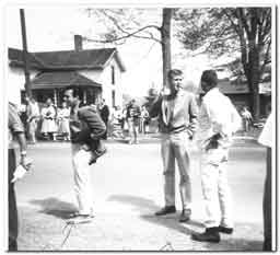 <p>Driveway of Clarence Darrow House - Martin Milner lights up a cigar in the driveway of the Clarence Darrow House.  As with another photo below, I believe that the short, dark-haired man facing left is director Arthur Hiller (can anyone confirm?). Again, this photo was provided by Doug Mathews and was shot by his parents.</p>