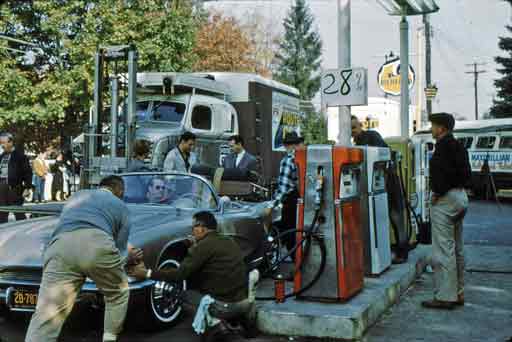 Station owner Ken Lay pumping gas.